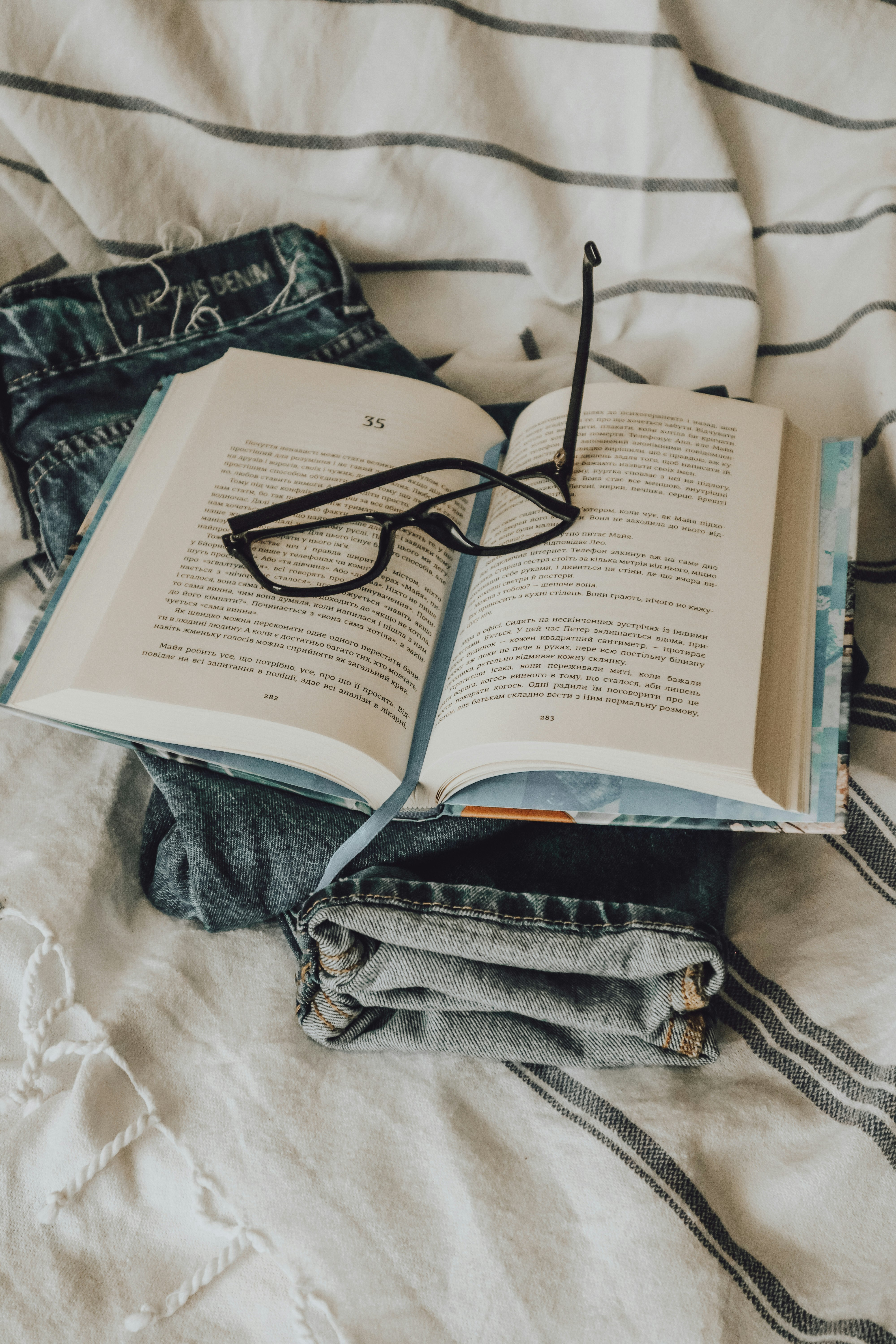 black framed eyeglasses on book page